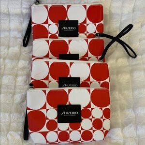 Set of Four Shiseido Red and White Circle Pattern Cosmetic Bags